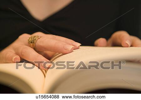 Stock Photo - Woman reading a book. Fotosearch
