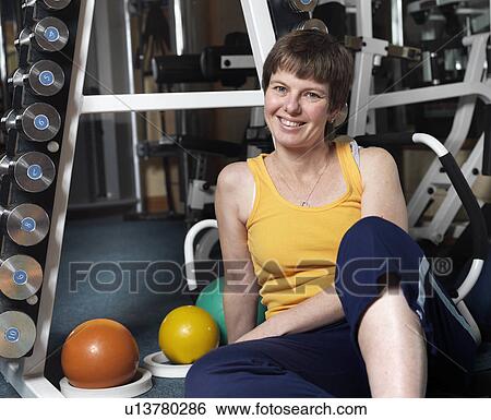 woman relaxing at gym View Large Photo Image Stock Photograph - woman relaxing at gym. Fotosearch