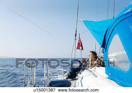 Woman Relaxing on Sailing Boat View Large Photo Image Stock Photo - Woman Relaxing on Sailing Boat. Fotosearch