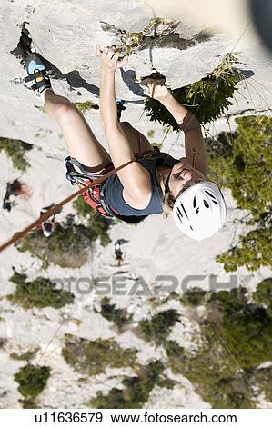 Woman rock climbing View Large Photo Image Stock Photo - Woman rock climbing. Fotosearch