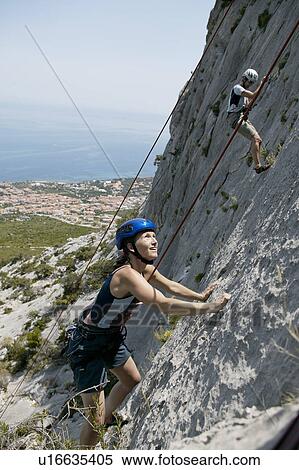 Woman rock climbing View Large Photo Image Stock Photography - Woman rock climbing. Fotosearch