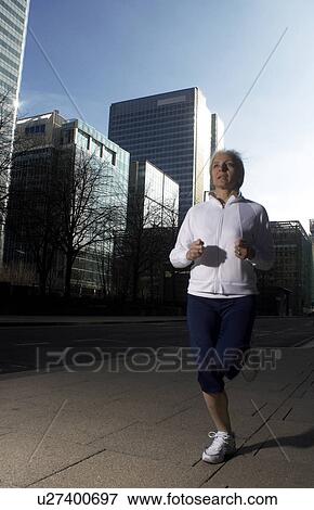 woman running in city View Large Photo Image Stock Photo - woman running in city. Fotosearch