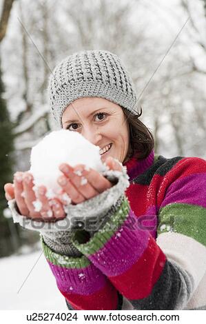 woman showing snowball View Large Photo Image Picture - woman showing snowball. Fotosearch