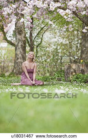 woman sitting in garden View Large Photo Image Stock Photo - woman sitting in garden. Fotosearch