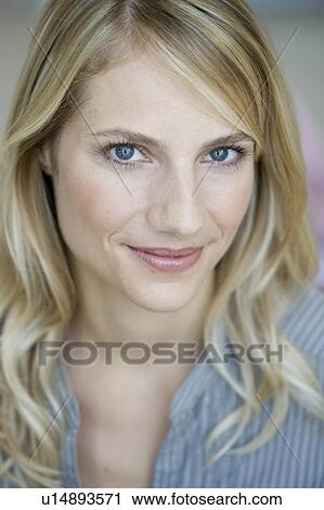 Stock Image - Woman smiling at viewer. Fotosearch