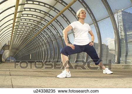 woman stretching in tunnel View Large Photo Image Stock Photography - woman stretching in tunnel. Fotosearch