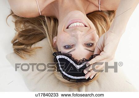 Stock Image - woman waking up. Fotosearch