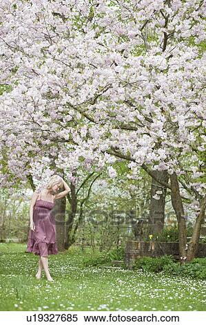 woman walking in garden View Large Photo Image Stock Photography - woman walking in garden. Fotosearch