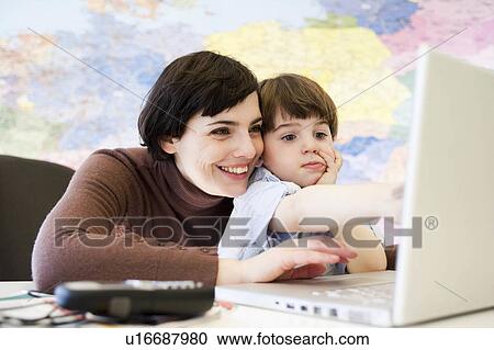 woman with boy in office View Large Photo Image Stock Image - woman with boy in office. Fotosearch