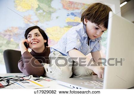woman with boy in office View Large Photo Image Stock Image - woman with boy in office. Fotosearch