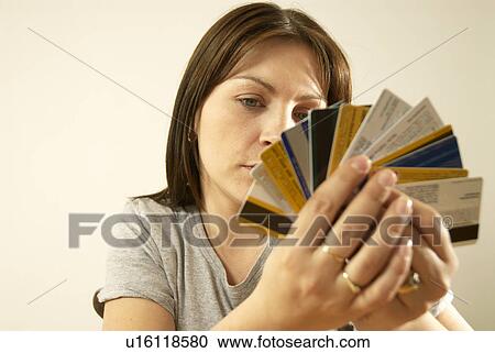 Stock Image - woman with credit cards. Fotosearch