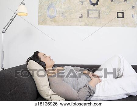 woman with eyes closed, headphones on. View Large Photo Image Stock Photograph - woman with eyes closed, headphones on.. Fotosearch