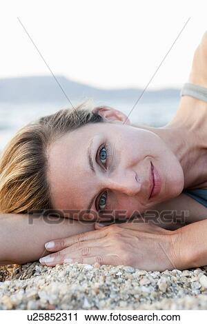 Stock Image - Woman With Relaxing On Beach Close Up. Fotosearch