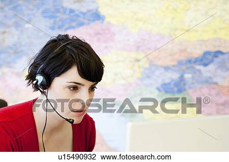 Stock Image - woman working in call center. Fotosearch