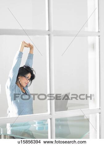 Picture - Woman working on computer. Fotosearch
