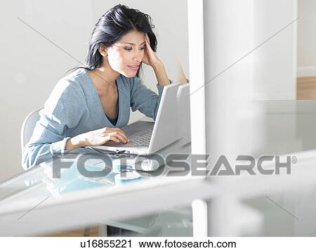 Woman working on computer View Large Photo Image Stock Image - Woman working on computer. Fotosearch