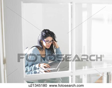 Woman working on computer View Large Photo Image Stock Image - Woman working on computer. Fotosearch