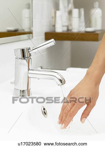 Woman's hand under the tap View Large Photo Image Stock Image - Woman's hand under the tap. Fotosearch