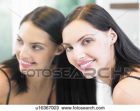Woman's reflection in the mirror View Large Photo Image Stock Image - Woman's reflection in the mirror. Fotosearch
