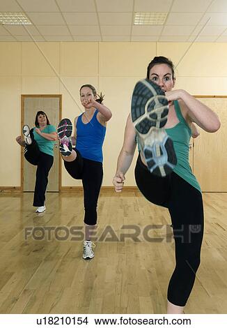 women aerobic kick exercise at gym View Large Photo Image Picture - women aerobic kick exercise at gym. Fotosearch