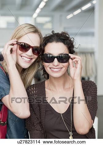 women with sunglasses looking at viewer View Large Photo Image Picture - women with sunglasses looking at viewer. Fotosearch