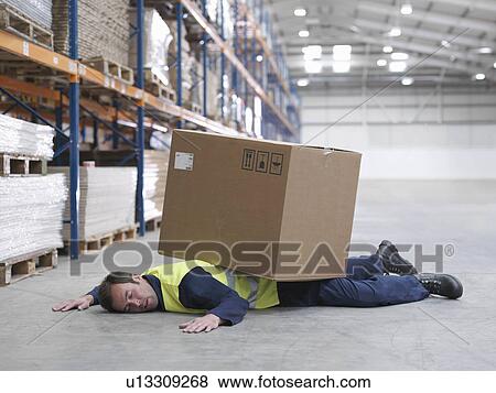 Worker Flattened By Box In Warehouse View Large Photo Image Stock Photo - Worker Flattened By Box In Warehouse. Fotosearch