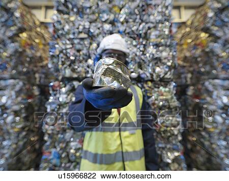 Worker Holding Can In Recycle Plant View Large Photo Image Stock Image - Worker Holding Can In Recycle Plant. Fotosearch