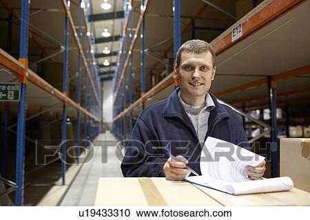 Worker in warehouse portrait View Large Photo Image Stock Image - Worker in warehouse portrait. Fotosearch