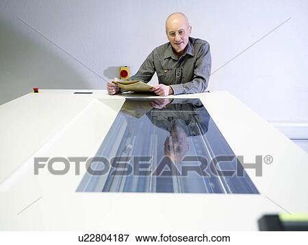 Worker Inspecting Printer View Large Photo Image Stock Photo - Worker Inspecting Printer. Fotosearch