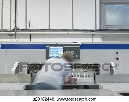 Worker Operating Printer View Large Photo Image Stock Photo - Worker Operating Printer. Fotosearch