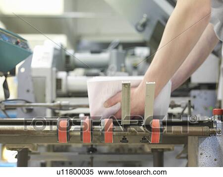 Stock Photography - Worker Operating Printer. Fotosearch