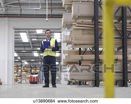 Worker With Clipboard In Warehouse View Large Photo Image Picture - Worker With Clipboard In Warehouse. Fotosearch