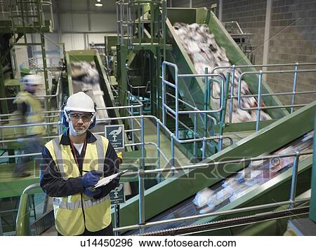 Worker With Notes In Recycle Plant View Large Photo Image Stock Photograph - Worker With Notes In Recycle Plant. Fotosearch