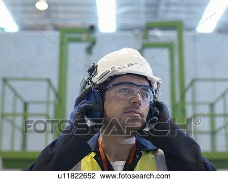 Stock Image - Worker With Protective Clothing. Fotosearch