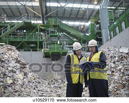 Stock Image - Workers In Recycle Plant. Fotosearch