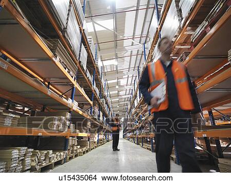 Workers In Warehouse View Large Photo Image Picture - Workers In Warehouse. Fotosearch