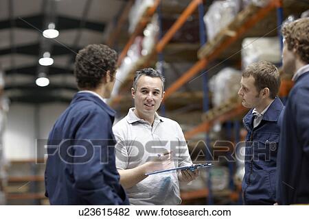 Workers in warehouse View Large Photo Image Stock Image - Workers in warehouse. Fotosearch