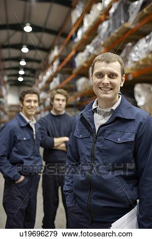 Stock Photo - Workers in warehouse. Fotosearch