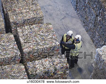 Workers With Bales Of Tin Cans View Large Photo Image Stock Photo - Workers With Bales Of Tin Cans. Fotosearch