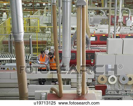 Stock Photography - Workers With Machines In Warehouse. Fotosearch
