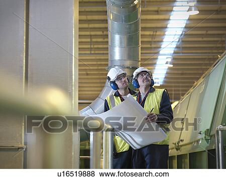 Workers With Plans In Plant View Large Photo Image Stock Photo - Workers With Plans In Plant. Fotosearch