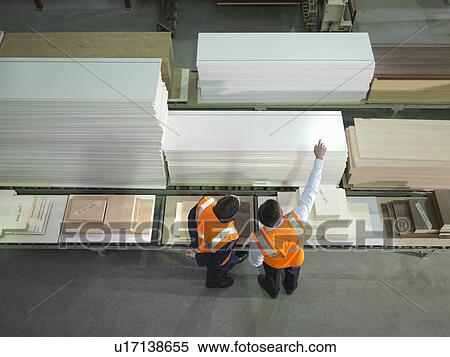 Stock Photography - Workers With Product In Warehouse. Fotosearch