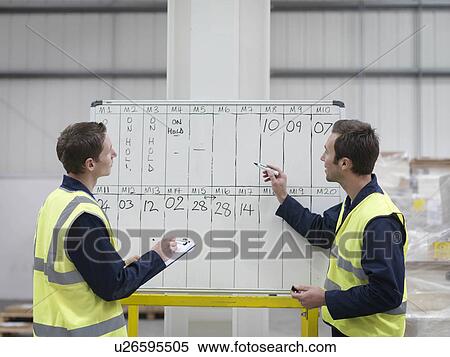 Workers With Whiteboard In Warehouse View Large Photo Image Stock Photography - Workers With Whiteboard In Warehouse. Fotosearch