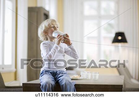 young boy playing with can phone View Large Photo Image Stock Photograph - young boy playing with can phone. Fotosearch