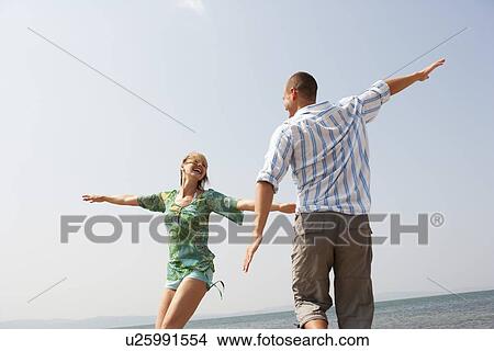 Young Couple Playing Air Plain View Large Photo Image Picture - Young Couple Playing Air Plain. Fotosearch