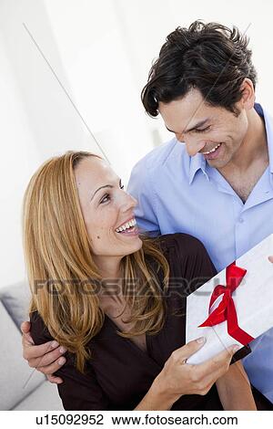 young couple with with gift View Large Photo Image Stock Image - young couple with with gift. Fotosearch