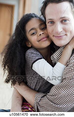 young girl and man embracing View Large Photo Image Stock Image - young girl and man embracing. Fotosearch