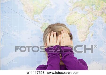 Stock Photo - young girl hiding face with hands. Fotosearch