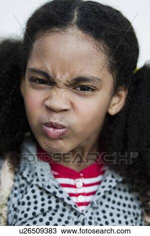 young girl making face at viewer View Large Photo Image Stock Image - young girl making face at viewer. Fotosearch