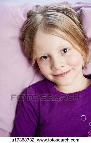 young girl on couch portrait View Large Photo Image Stock Image - young girl on couch portrait. Fotosearch